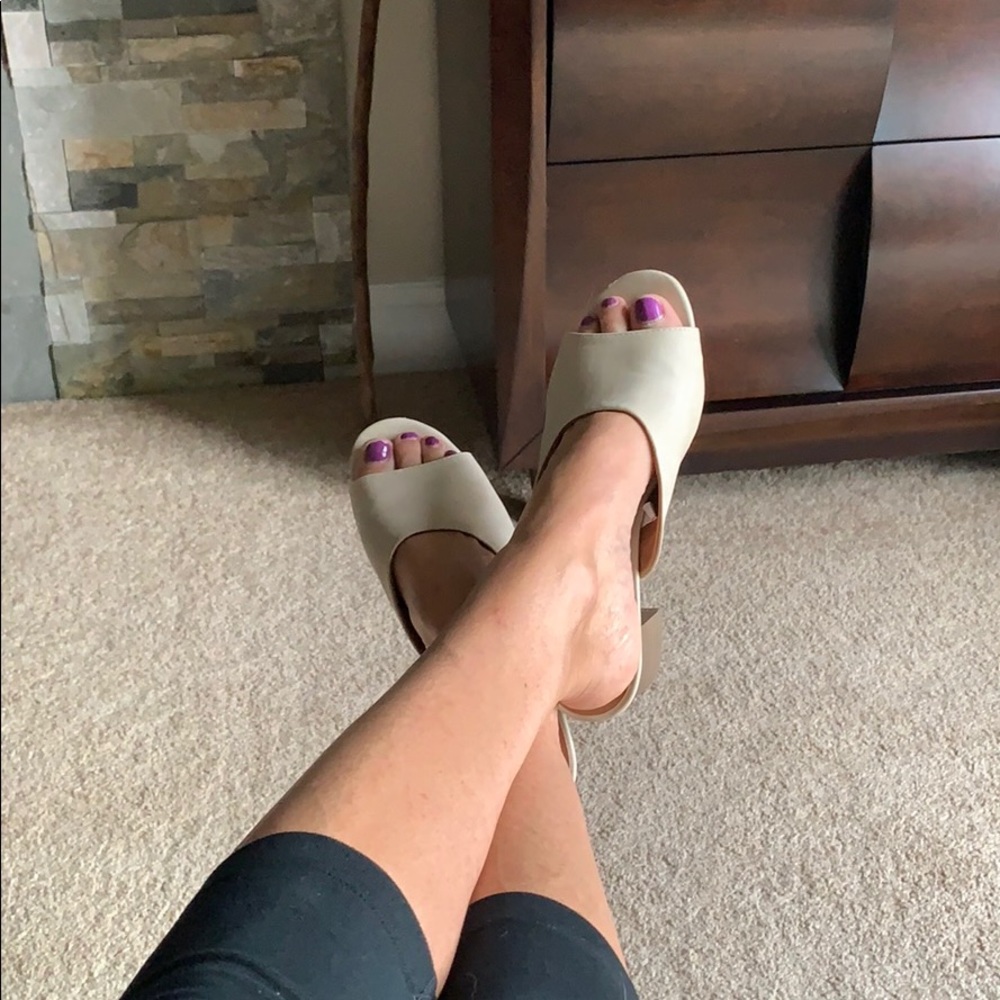 Cream colored slide sandals with stacked heel